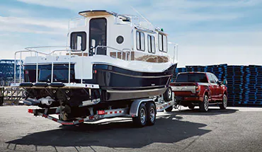 2022 Nissan TITAN Truck towing boat | Nationwide Nissan in Timonium MD